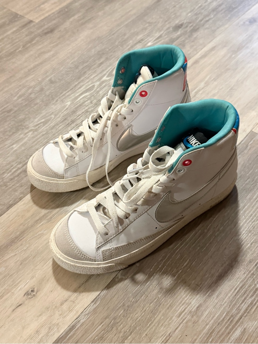 Nike Women’s Mid-Top Sneakers in White with Teal Lining and Silver Swoosh
